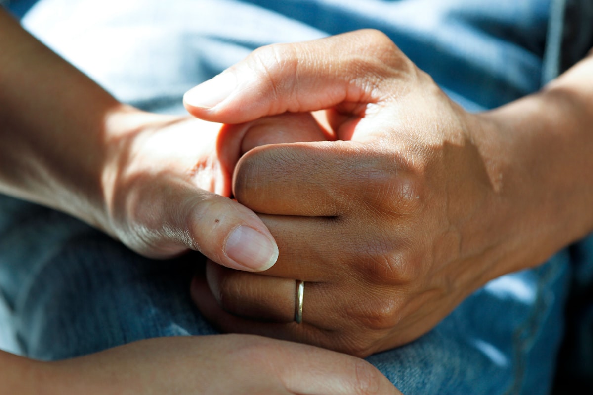 Hands held in care and support